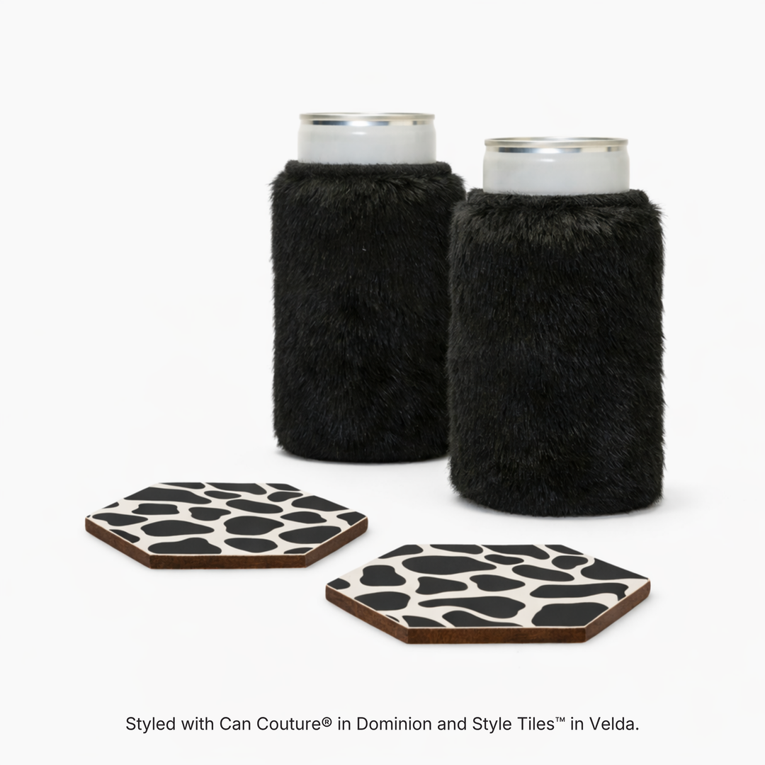 Black faux fur can sleeves in Dominion with hexagonal coasters in Velda cow print