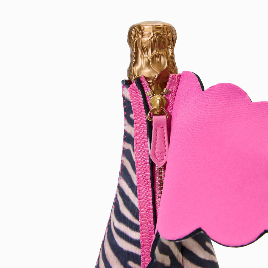 Close-up of gold zip with pink vegan leather pull featuring debossed monogram