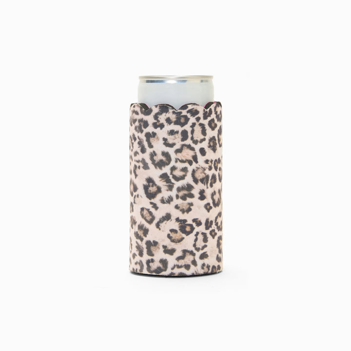 Leopard print can sleeve with scalloped edge, holding a can