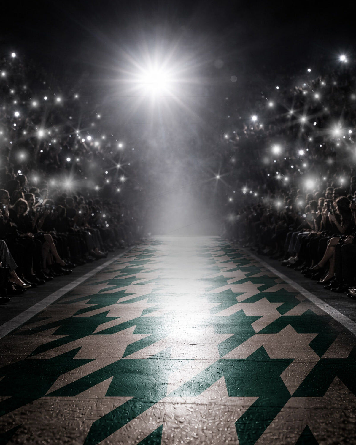 Fashion runway with a green and cream houndstooth catwalk, lit by camera flashes from the front row crowd