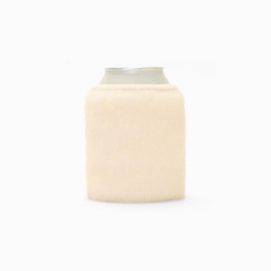 Cream faux fur can sleeve holding a can