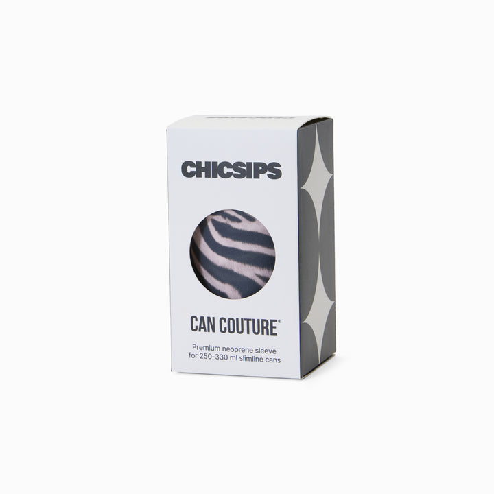 White Chic Sips Can Couture product packaging box with black text and circular cut-out showing Nocturne zebra print can sleeve design