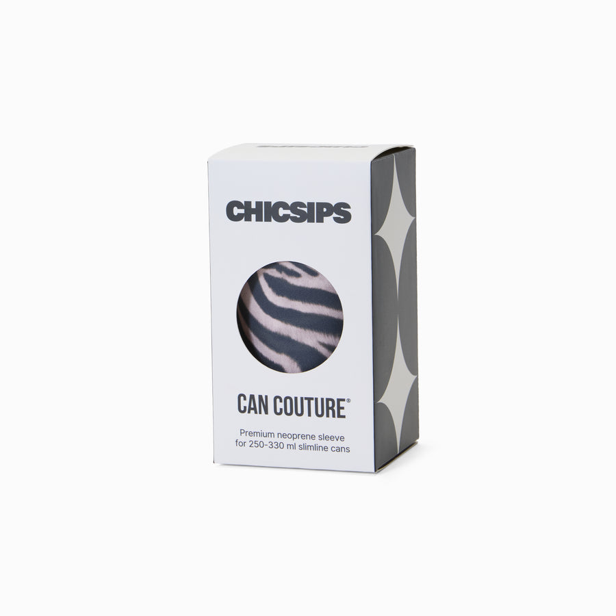 White Chic Sips Can Couture product packaging box with black text and circular cut-out showing Nocturne zebra print can sleeve design