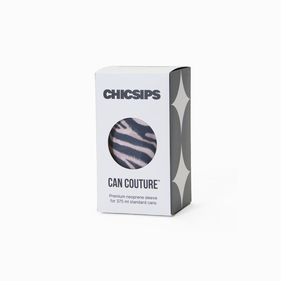 White Chic Sips Can Couture product packaging box with black text and circular cut-out showing Nocturne zebra print can sleeve design