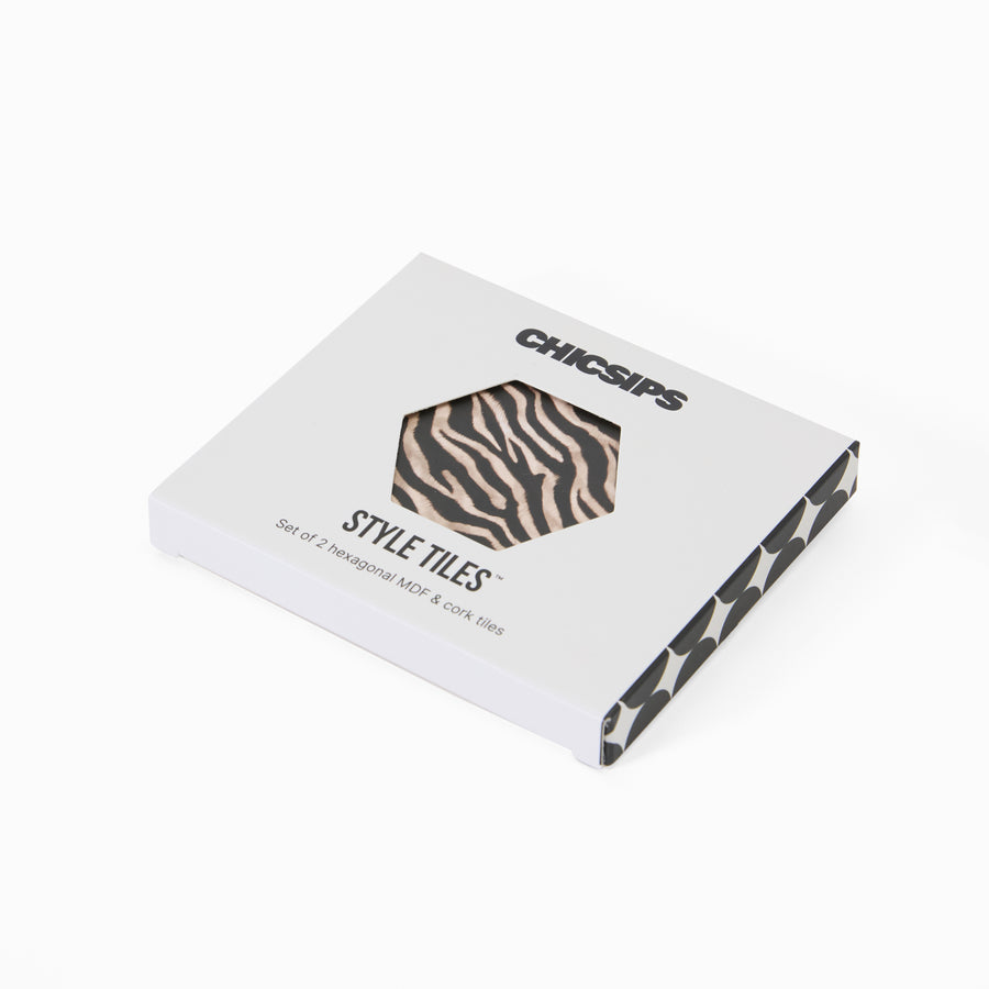 Style Tiles packaging box with hexagon window showing zebra print coaster 