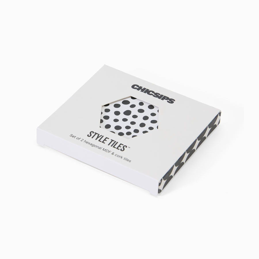 Style Tiles packaging box with hexagon window showing black and white polka dot coaster