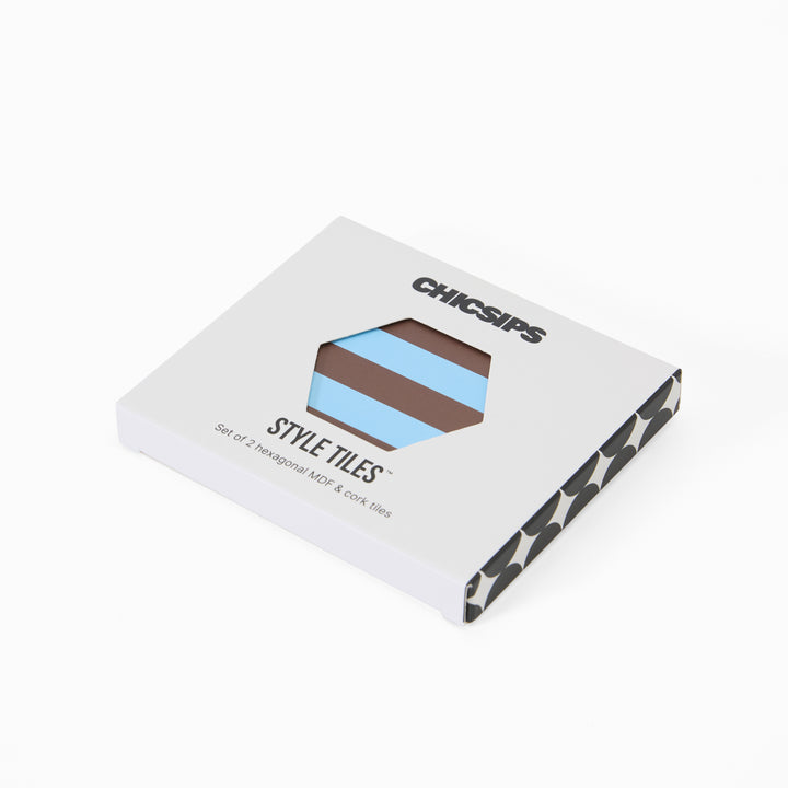 Style Tiles packaging box with hexagon window showing blue and chocolate stripe print coaster
