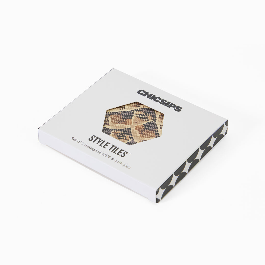 Style Tiles packaging box with hexagon window showing snake print coaster