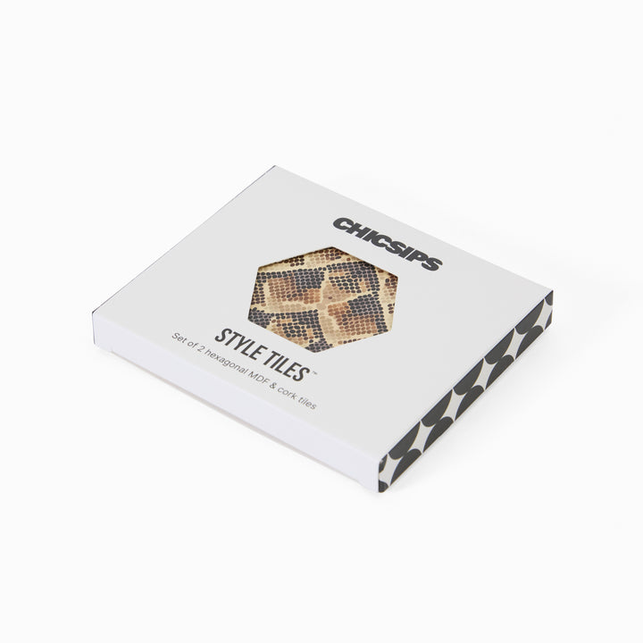 Style Tiles packaging box with hexagon window showing snake print coaster