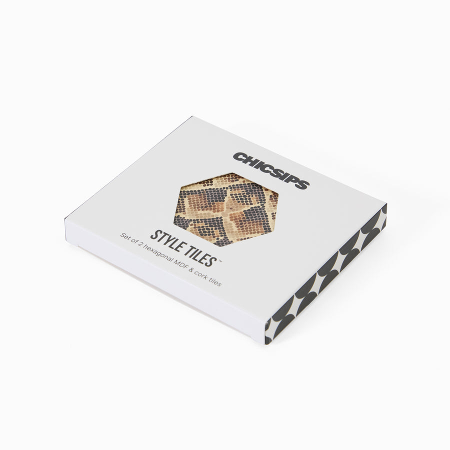 Style Tiles packaging box with hexagon window showing snake print coaster
