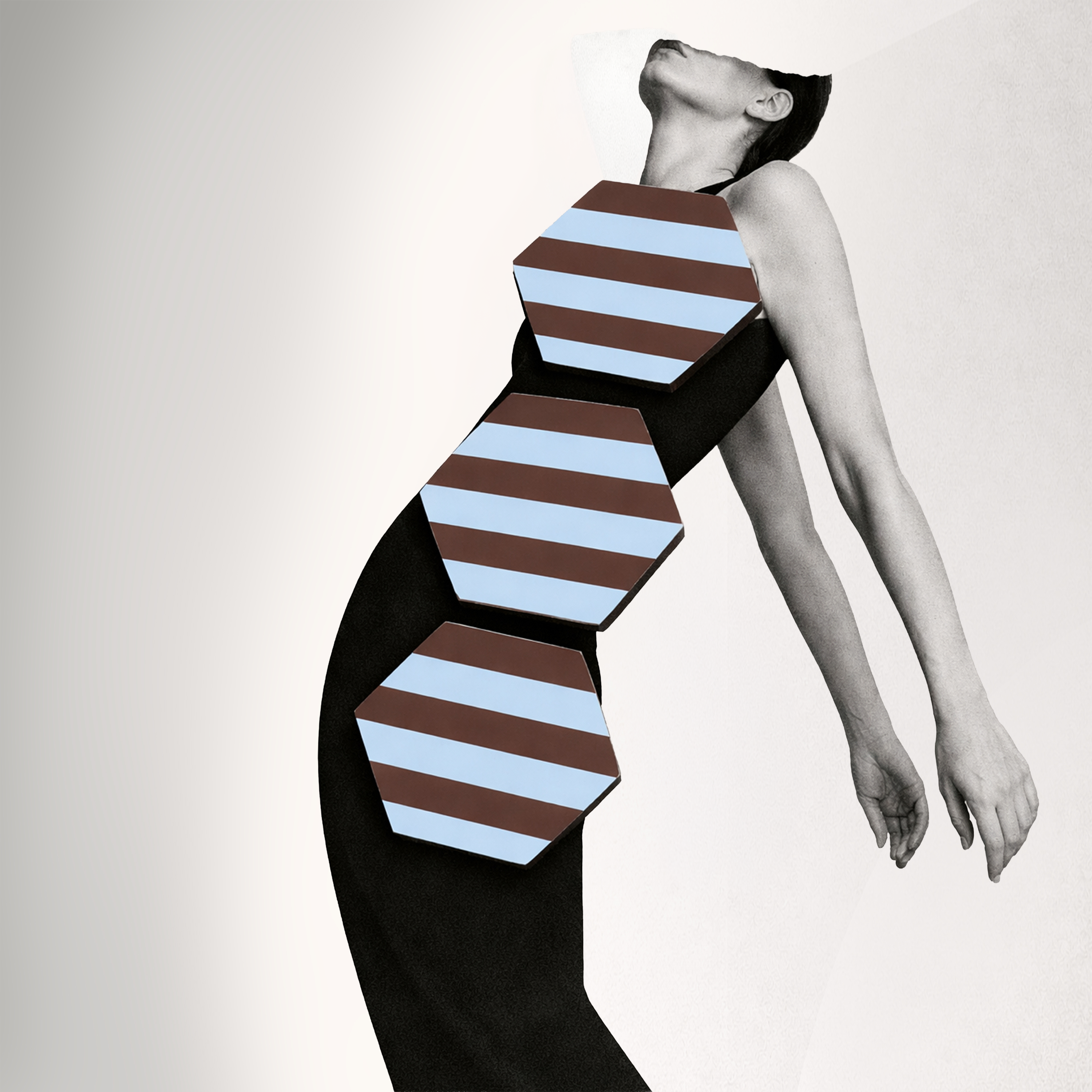 Black and white image of model styled with blue and chocolate striped hexagonal coasters