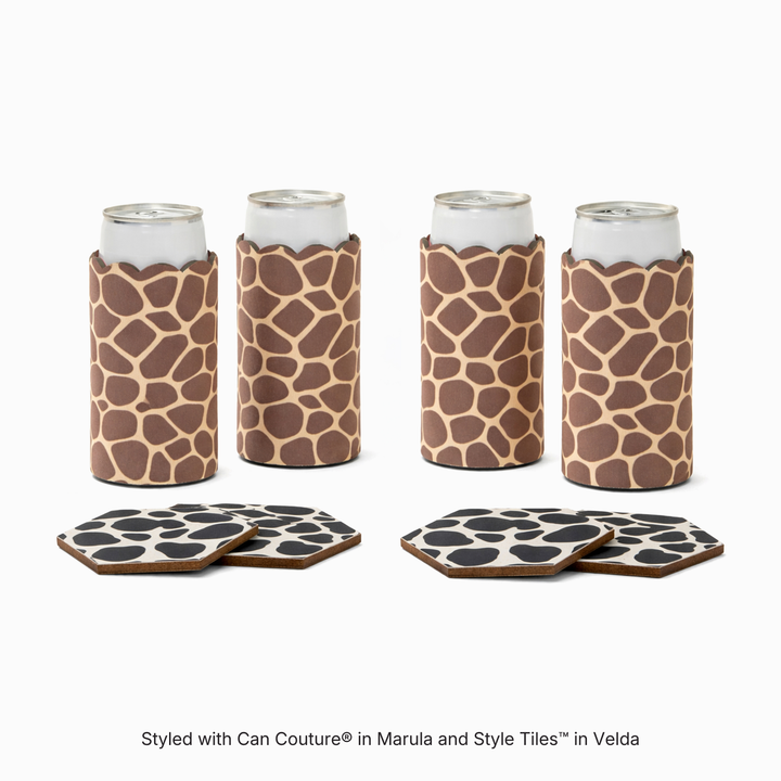 Four can sleeves in Marula giraffe print with four hexagonal coasters in Velda cow print