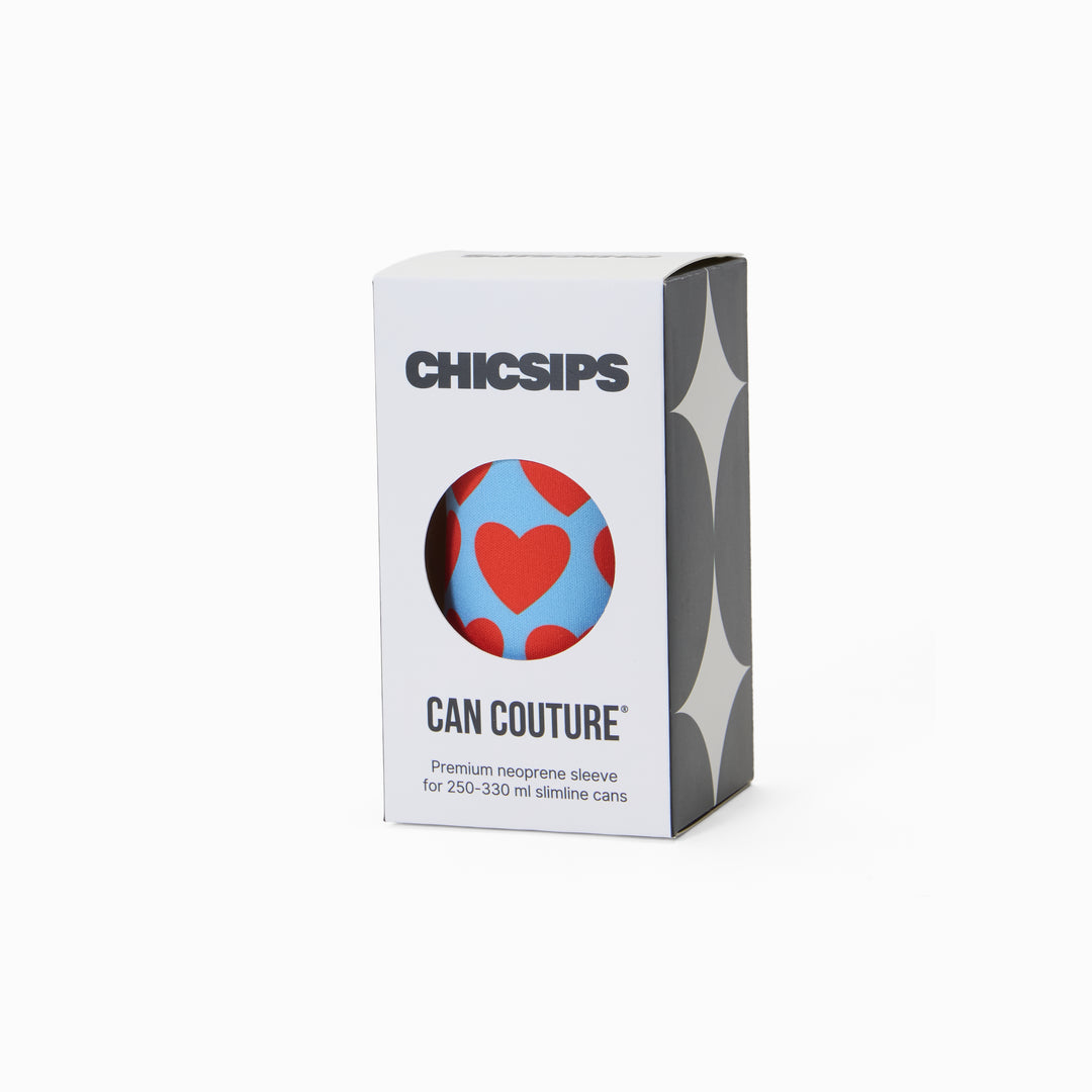 Can Couture packaging box with circular window showing blue and red heart print neoprene can sleeve