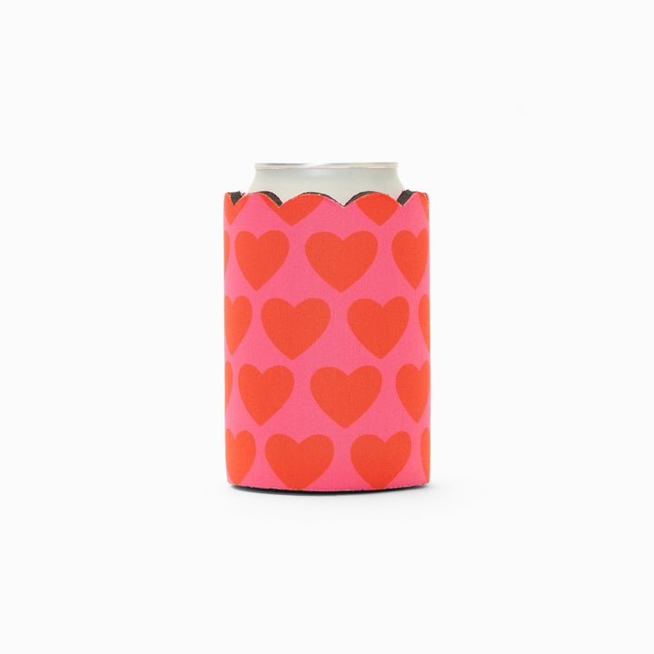 Pink and red heart print can sleeve with scalloped edge, holding a can