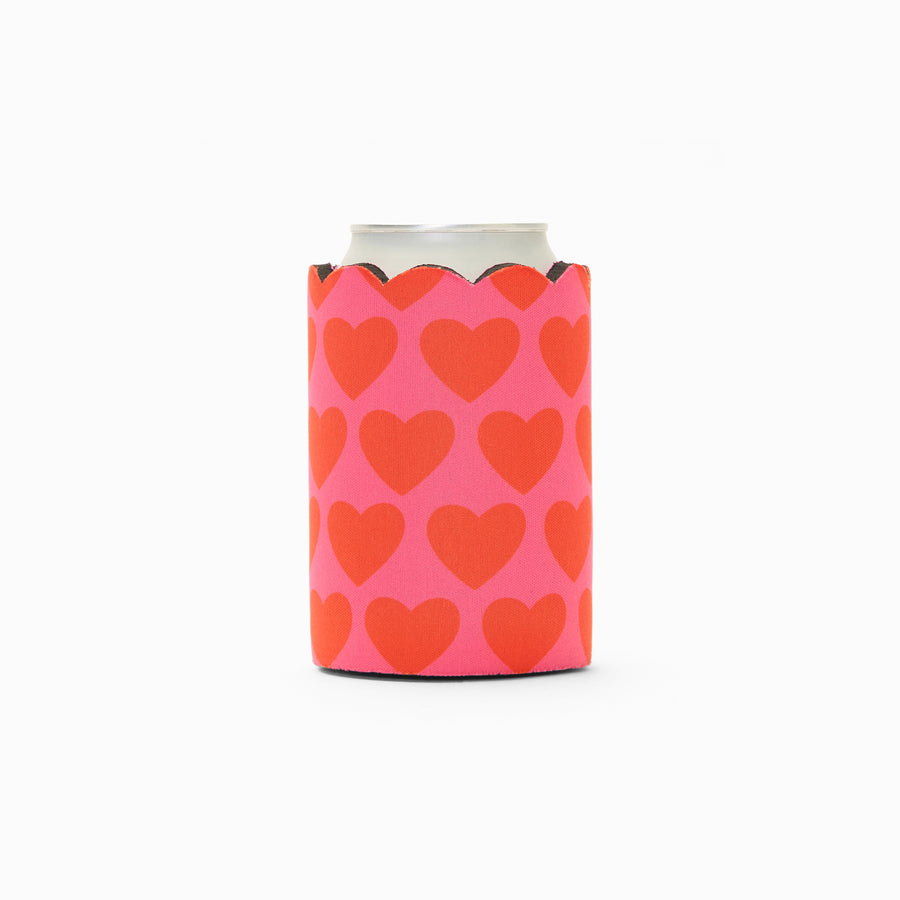 Pink and red heart print can sleeve with scalloped edge, holding a can