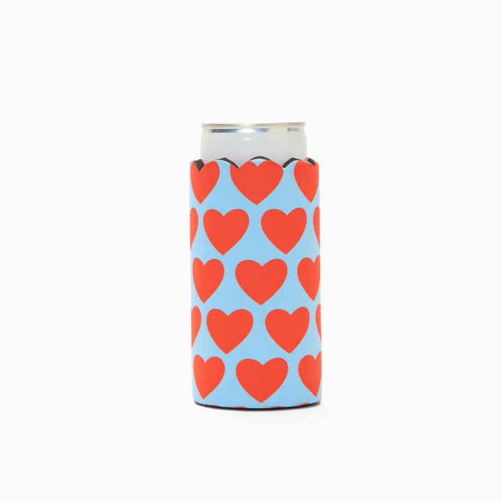 Blue and red heart print can sleeve with scalloped edge, holding a can