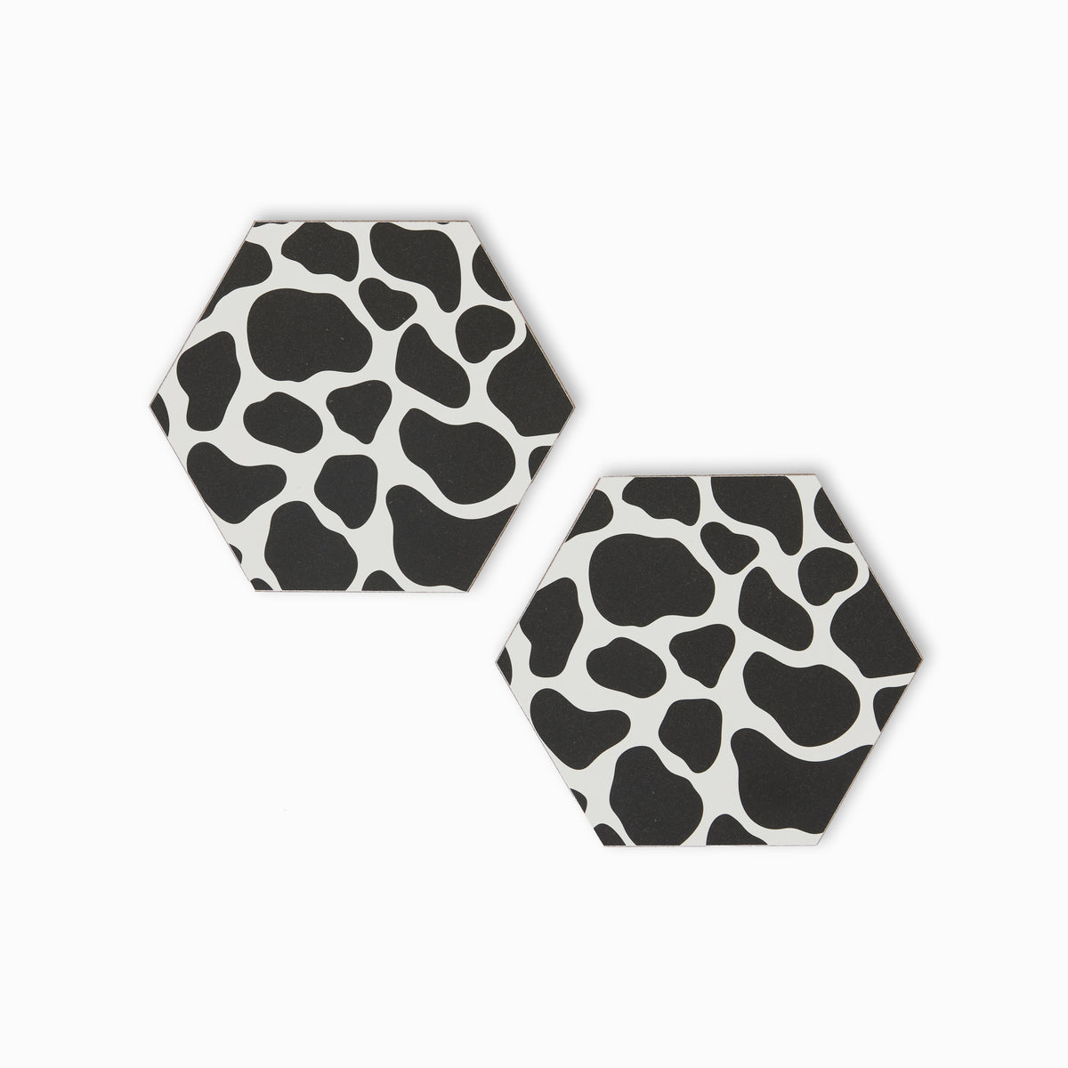 Two cow print hexagonal coasters 
