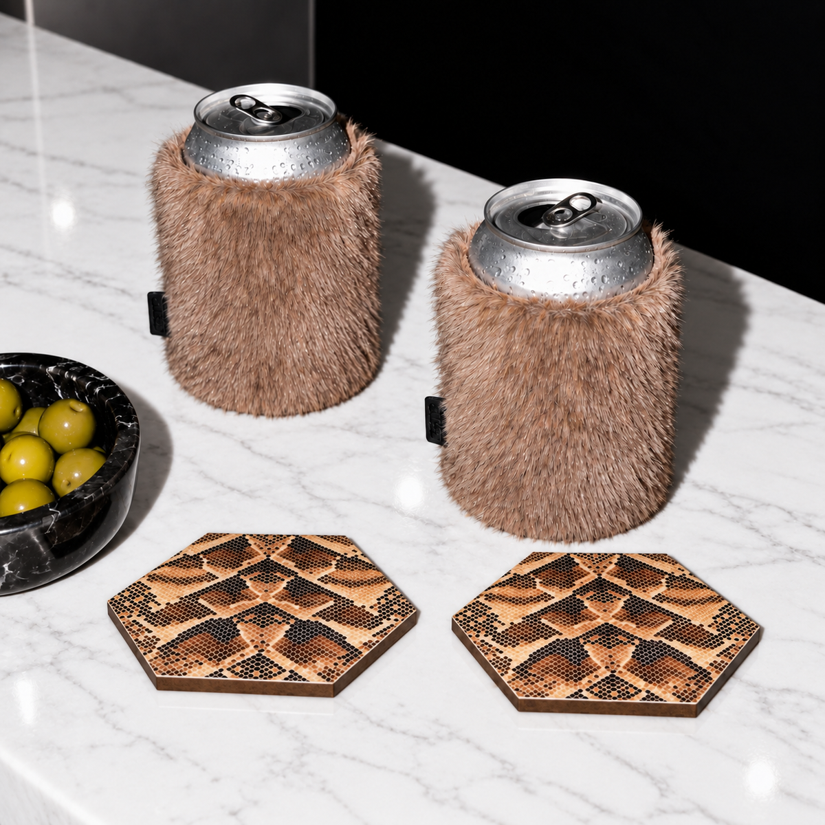 Can Couture faux fur can sleeves in Uptown mink brown with snake print Style Tiles coasters and olives on marble