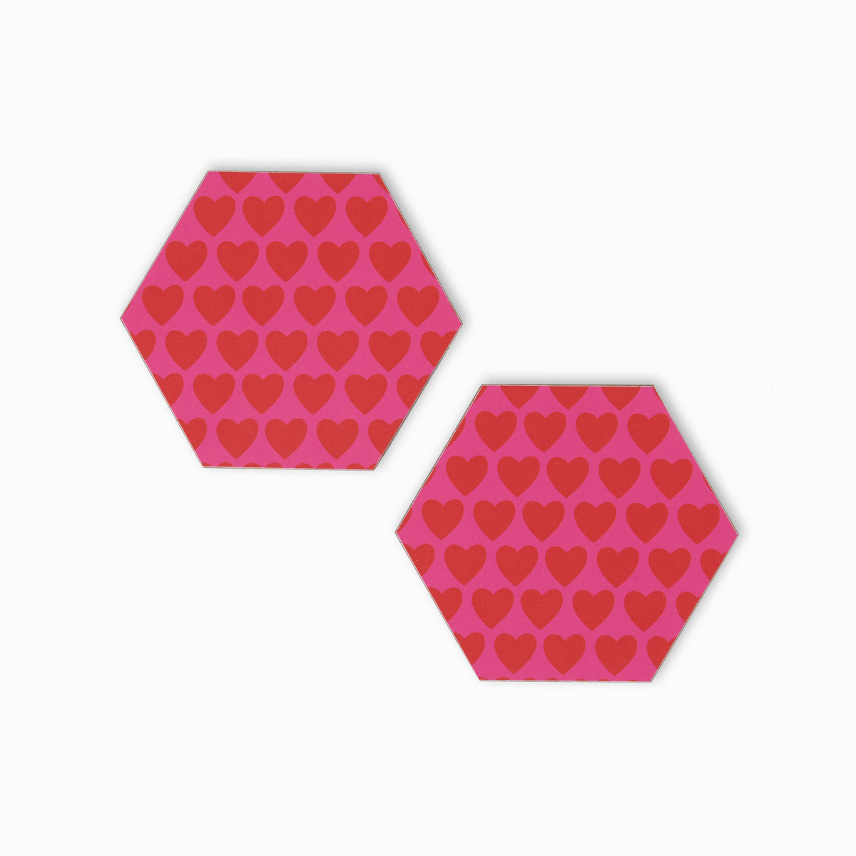 Two pink and red heart print hexagonal coasters