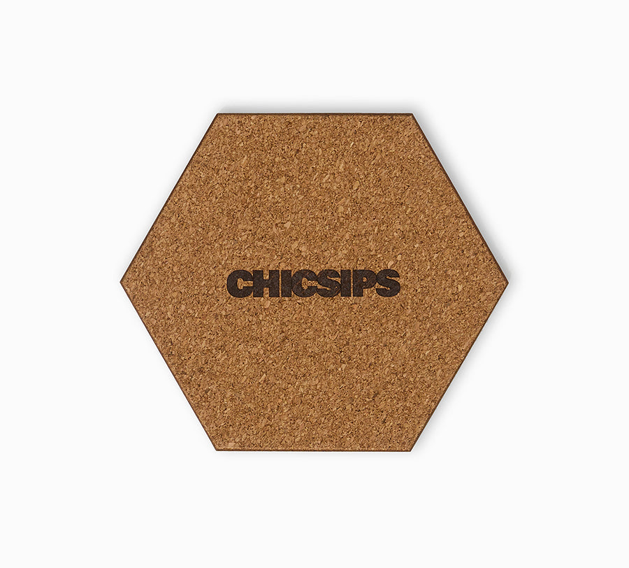 Hexagonal coaster with cork base and brand stamp