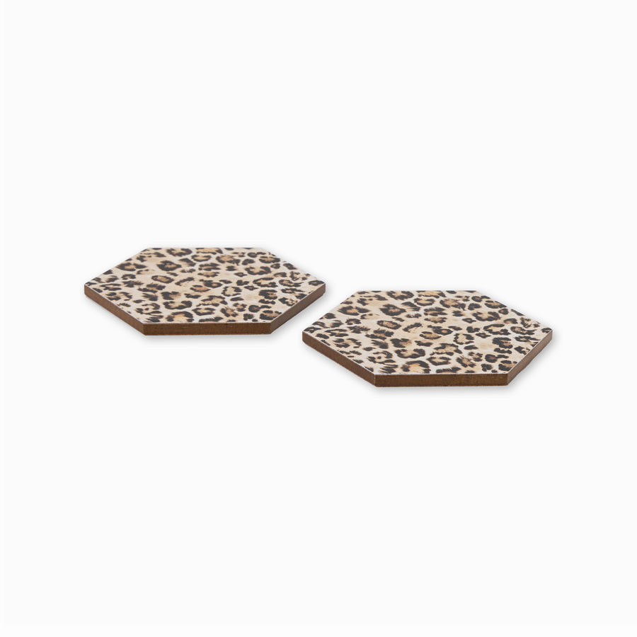 Two leopard print hexagonal coasters shown from side angle