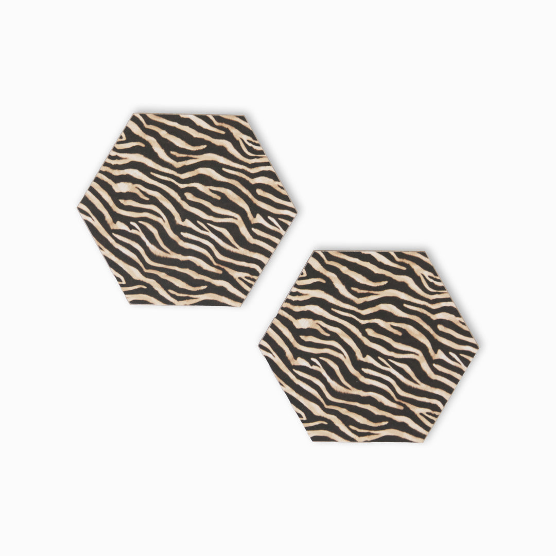 Two zebra print hexagonal coasters